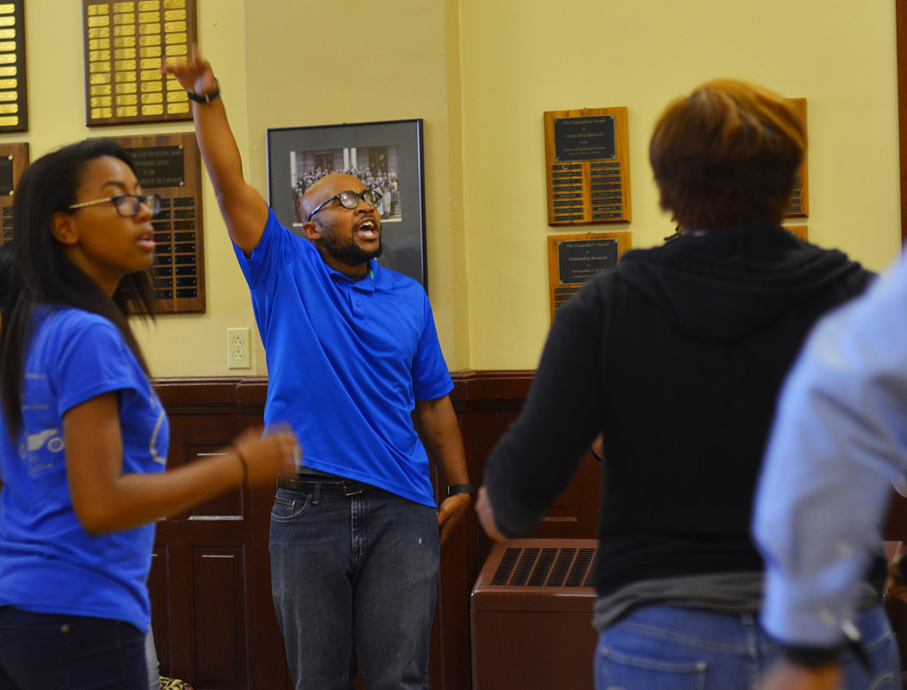 Graduate student Jonathan Butler leads the protestors in a chant in Jesse Hall at the University of Missouri in Columbia, Missouri, on Tuesday, Oct. 6, 2015. (KOMUNews image via Creative Commons license.)